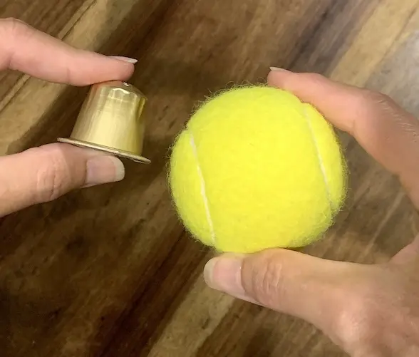 Nespresso capsule size compared to tennis ball